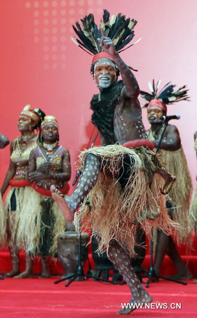 Performers dance during activities marking the National Pavilion Day of the Democratic Republic of the Congo in the World Expo Park in Shanghai, east China, on June 23, 2010. The National Pavilion Day of the Democratic Republic of the Congo is celebrated on Wednesday. 