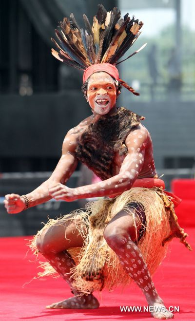 An actor performs during activities marking the National Pavilion Day of the Democratic Republic of the Congo in the World Expo Park in Shanghai, east China, on June 23, 2010. The National Pavilion Day of the Democratic Republic of the Congo is celebrated on Wednesday. 