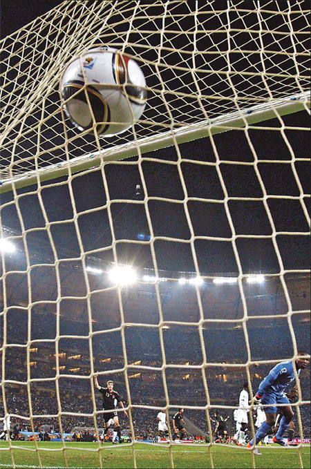 Ghana's goalkeeper, Richard Kingson, watches as the ball hits the back of his net after a goal by Germany's Mesut Ozil during their Group D match at Soccer City stadium in Johannesburg on Wednesday. [Siphiwe Sibeko / reuters]