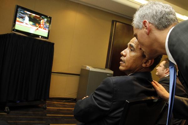 U.S. President Barack Obama watches a live telecast of the 2010 World Cup soccer match between the U.S. and Ghana during a short break at the G20 Summit in Toronto June 26, 2010.