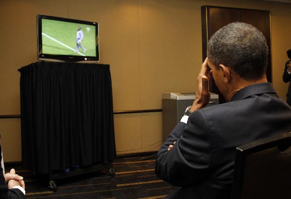 U.S. President Barack Obama watches a live telecast of the 2010 World Cup soccer match between the U.S. and Ghana during a short break at the G20 Summit in Toronto June 26, 2010.