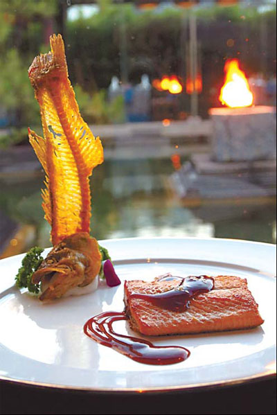 Flaky trout fillet served at Bai Yun, the Banyan Tree Lijiang, features fresh Lijiang trout. Photos by Pauline D Loh / For China Daily