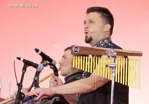 Serbian artists perform during a ceremony marking the Serbia National Pavilion Day at the Shanghai World Expo in Shanghai, east China, June 27, 2010. 