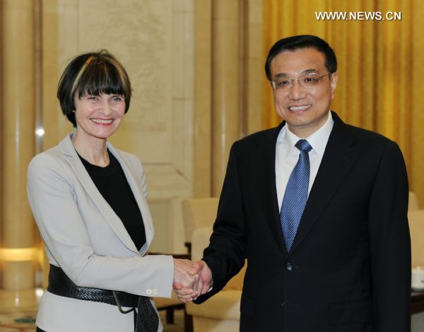 Chinese Vice Premier Li Keqiang (R) shakes hands with Swiss Foreign Minister Micheline Calmy-Rey during their meeting in Beijing, capital of China, on June 28, 2010. [Rao Aimin/Xinhua]