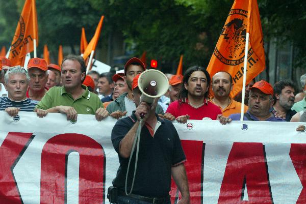 Greek protesters stage a protest in front of Greek Finance Ministry against austerity measures in Athens, capital of Greece, on June 28, 2010. The demonstration was held ahead of a 24-hour nationwide general strike planned on June 29 by the two main labor unions of public and private sector employees in Greece. [Marios Lolos/Xinhua]