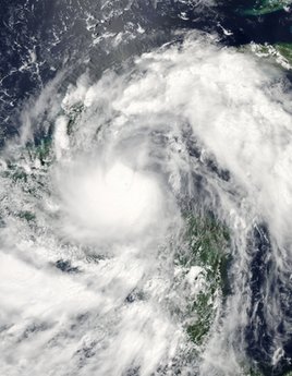 This June 26, 2010 NASA Aqua satellite image shows Tropical Storm Alex hovering over Guatemala, Belize, and Honduras. [Agencies] 