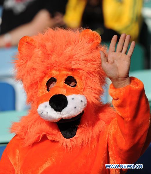 A fan of the Netherlands waits for the start of the 2010 World Cup round of 16 soccer match between the Netherlands and Slovakia at Moses Mabhida stadium in Durban, South Africa, on June 28, 2010. (Xinhua/Chen Haitong) 