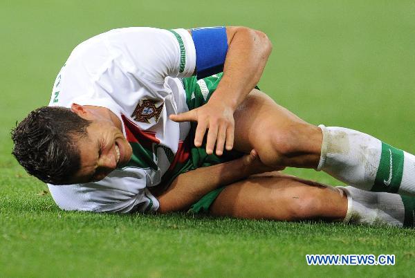 Cristiano Ronaldo of Portugal reacts after injured during the 2010 World Cup round of 16 soccer match against Spain at Green Point stadium in Cape Town, South Africa, on June 29, 2010. Spain won the match 1-0. [Xinhua] 