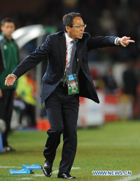 Japan&apos;s coach Takeshi Okada reacts during the 2010 World Cup round of 16 soccer match against Paraguay at Loftus Versfeld Stadium in Tshwane, South Africa, on June 29, 2010. Japan lost 3-5 in a penalty shootout. [Xinhua]