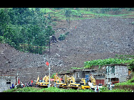 This June 29, 2010 photo shows a general view of the debris after a rain-triggered landslide that on Monday afternoon buried about 107 people, in Dazhai village of Guanling County, Southwest China's Guizhou province. [Xinhua]
