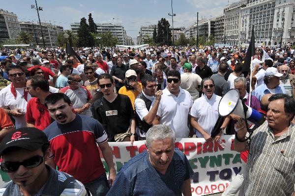 Greek strikers take part in a protest in central Athens on Tuesday, June 29, 2010. (Xinhua/AFP Photo)