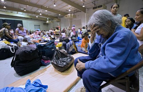 An elderly woman cries at a shelter in Matamoros, Tamaulipas state, Mexico on June 30, 2010. Hurricane Alex was set to make landfall late Wednesday or early Thursday south of the US border with Mexico, possibly as a Category Two hurricane, the Miami-based National Hurricane Center said. [Xinhua]