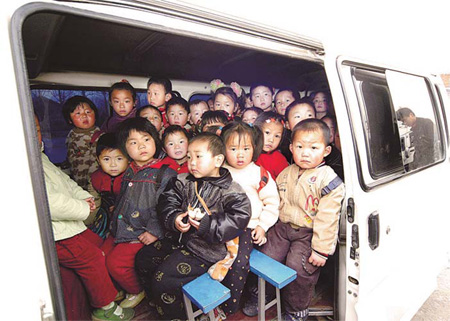 Children are crammed into a minivan in Xuchang, Henan province, on their way to a local kindergarten in this file photo.