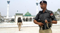 Policemen guard at site after deadly blast in Lahore, Pakistan