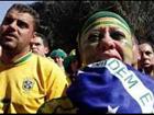 Brazilian fans in disappointment, Dutch fans celebrate