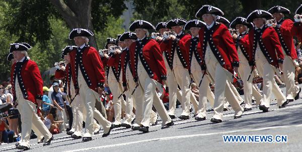 Honor guard take part in the Independence Day parade in Washington D.C., capital of the United States, July 4, 2010. The United States celebrated its 234th Independence Day on Sunday. [Zhang Jun/Xinhua]