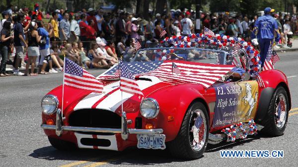 People take part in the Independence Day parade in Washington D.C., capital of the United States, July 4, 2010. The United States celebrated its 234th Independence Day on Sunday. [Zhang Jun/Xinhua]