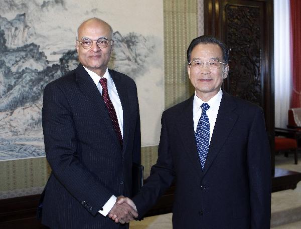 Chinese Premier Wen Jiabao (R) meets with visiting Indian prime ministerial special envoy Shiv Shankar Menon, who served as Indian National Security Advisor, in Beijing, capital of China, on July 5, 2010. [Liu Jiansheng/Xinhua]