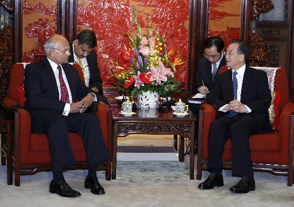 Chinese Premier Wen Jiabao (1st R) meets with visiting Indian prime ministerial special envoy Shiv Shankar Menon (1st L), who served as Indian National Security Advisor, in Beijing, capital of China, on July 5, 2010. [Liu Jiansheng/Xinhua]