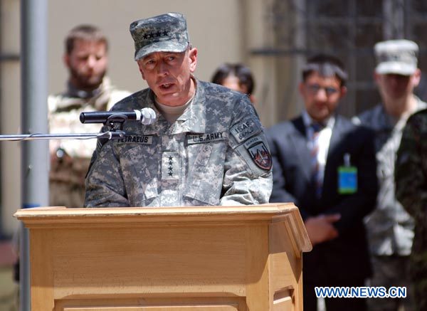 U.S. General David Petraeus, new military commander of U.S. and NATO forces in Afghanistan, speaks during a change of commander ceremony in Kabul July 4, 2010. [Xinhua]