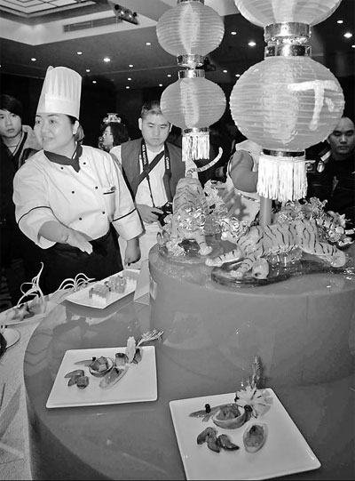 A Chinese culinary exhibition is held at the Shanghai Hotel earlier this year. For Shanghai, the immediate concern of hoteliers is to find beds for visitors flooding in to visit the World Expo. [China Daily]