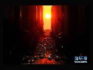 Cars run at the sunset on the 42nd Street, Manhattan of New York, the United States, July 5, 2010. The National Weather Service said the temperature is expected to be 95 degrees Fahrenheit (35 degrees Celsius) or above on those days.[Xinhua/Shen Hong]  