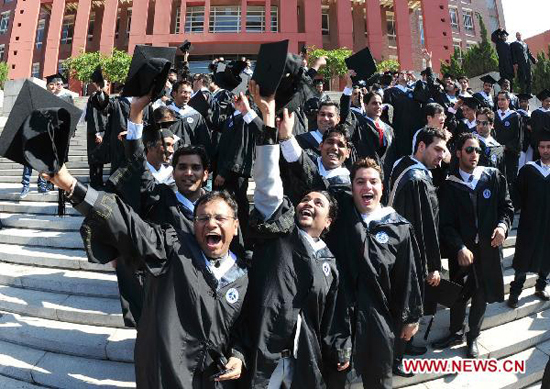 Foreign students attend graduation at Tianjin Medical University in north China's Tianjin Municipality, on July 6, 2010. More than 340 foreign students graduated from Tianjin Medical University Tuesday.
