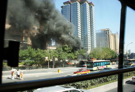 A bus catches fire near Huawei Bridge, Chaoyang district, Beijing, on July 6. There are no reports of any casualties.