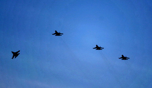 Formation of aircraft joining in a navy military exercise is seen in the water of East China Sea onJuly 6, 2010.