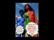 Protestors painted in the colours of flags of various countries hold signs and chant slogans during a demonstration against the fur industry in Johannesburg July 8, 2010. According to the PETA website, the event led by FHM model Candice Brink and participated by protestors from People for the Ethical Treatment of Animals (PETA) Asia, Fur Free South Africa and the South African Naturist Federation will highlight the plight of animals used in coats and other clothing items. [163.com]