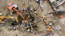 Boy who falls into pile hole extricated