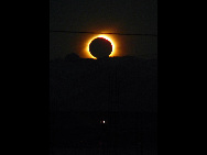 The sun is seen partially covered by the moon on Easter Island, 3700 km off the Chilean coast in the Pacific Ocean, July 11, 2010. A total solar eclipse drew an 11,000-kilometer (6,800-mile) arc over the Pacific Sunday, plunging remote isles into darkness in a heavenly display climaxing on mysterious Easter Island.([Xinhua/Reuters]