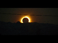 The sun is seen partially covered by the moon on Easter Island, 3700 km off the Chilean coast in the Pacific Ocean, July 11, 2010. A total solar eclipse drew an 11,000-kilometer (6,800-mile) arc over the Pacific Sunday, plunging remote isles into darkness in a heavenly display climaxing on mysterious Easter Island.[Xinhua/Reuters]