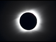 The sun is seen partially covered by the moon on Easter Island, 3700 km off the Chilean coast in the Pacific Ocean, July 11, 2010. A total solar eclipse drew an 11,000-kilometer (6,800-mile) arc over the Pacific Sunday, plunging remote isles into darkness in a heavenly display climaxing on mysterious Easter Island.[Xinhua/Reuters]