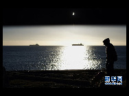 The moon passes between the sun and the earth during a solar eclipse in Valparaiso City, 75 miles (121 km) northwest of Santiago, July 11, 2010.[Xinhua/Reuters] 