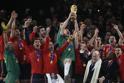 Spain goalkeeper Iker Casillas holds up the World Cup trophy after the World Cup final soccer match between the Netherlands and Spain at Soccer City in Johannesburg, South Africa, Sunday, July 11, 2010. Spain won 1-0.