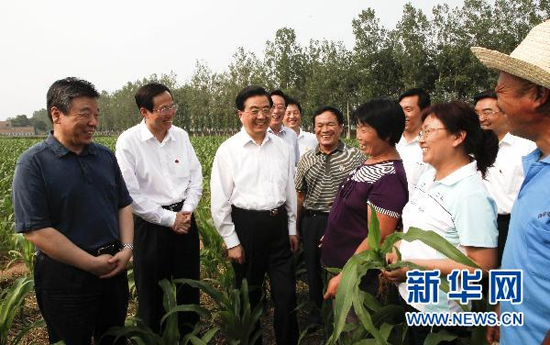 President Hu Jintao talks with local farmers during this trip in Henan Province from Friday through Sunday.