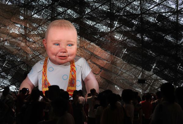 A 'baby' wears a football scarf in the Spain Pavilion at the 2010 World Expo in Shanghai, east China, July 12, 2010. Spain won the football world cup for the first time in their history after defeating Holland in the final. 