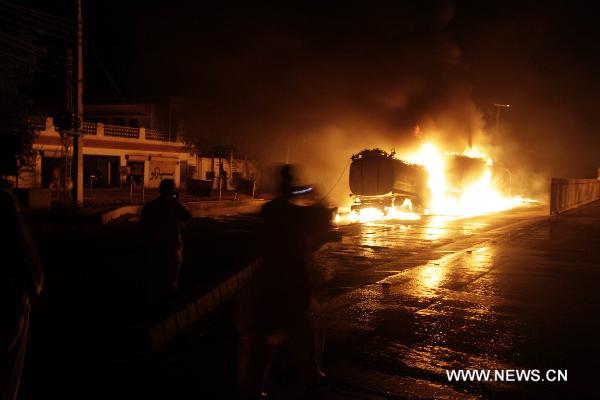 Fire rages after NATO oil tanks were attacked by unknown militants in northwest Pakistani city of Peshawar on July 13, 2010. At least three NATO oil tankers were burned and seven other vehicles were also set fire on the outskirts of Peshawar during the attack. [Umar Qayyum]