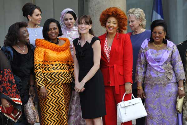 Central African Republic First Lady Monique Bozize, Gabon First Lady Sylvia Bongo Ondimba, Benin First Lady Chantal de Souza Yayi, Mauritania First Lady Tekber Mint Melainine Ould Ahmed, French First Lady Carla Bruni-Sarkozy, Cameroon First Lady Chantal Biya, Senegal First Lady Viviane Wade and Mali First Lady Lobbo Traore Toure pose on the steps at the Elysee Palace in Paris after a meeting, July 13, 2010. [Xinhua]