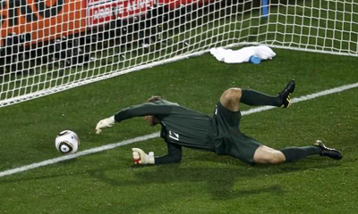 England's goalkeeper, Robert Green, reacts after missing the ball during its Group C first-round match against the US on June 12 at Royal Bafokeng stadium in Rustenburg. 