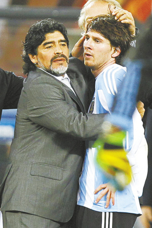 Argentina's coach, Diego Maradona, hugs Lionel Messi after the side lost to Germany 4-0 in the quarterfinals at Green Point stadium in Cape Town on July 3. 