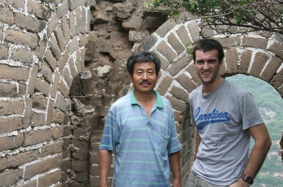 Mr. Chen and I take a break from hiking Hunchback curve to have our picture taken in a tower of the Great Wall of China that has stood the test of time. 