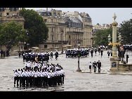 The annual Bastille Day millitary parade in Paris , July 14 , 2010. French President Nicolas Sarkozy and leaders from 13 African countries attended the military parade marking France's Bastille Day. [Xinhua] 