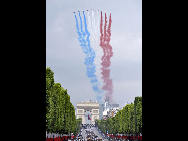 Planes fly during the France's Bastille Day military parade held in Paris, capital of France, on July 14, 2010.  [Xinhua]