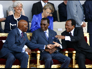 (From L to R) Senegalese President Abdoulaye Wade, Chadian President Idriss Deby and Cameroon President Paul Biya talks during the France's Bastille Day military parade held in Paris, capital of France, on July 14, 2010.  [Xinhua]