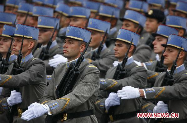 French soldiers march during the France&apos;s Bastille Day military parade held in Paris, capital of France, on July 14, 2010. French President Nicolas Sarkozy and leaders from 13 African countries attended the military parade marking France&apos;s Bastille Day on July 14. [Zhang Yuwei/Xinhua]