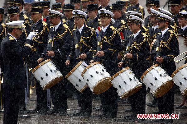 French military band perform during the France&apos;s Bastille Day military parade held in Paris, capital of France, on July 14, 2010. French President Nicolas Sarkozy and leaders from 13 African countries attended the military parade marking France&apos;s Bastille Day on July 14. [Zhang Yuwei/Xinhua]