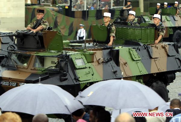 French soldiers march during the France&apos;s Bastille Day military parade held in Paris, capital of France, on July 14, 2010. French President Nicolas Sarkozy and leaders from 13 African countries attended the military parade marking France&apos;s Bastille Day on July 14. [Zhang Yuwei/Xinhua]