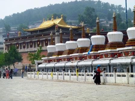 The eight stupas in front of Kumbum, representing major events in the life of Shakyamuni Buddha. [Photo by Lola Boatwright]